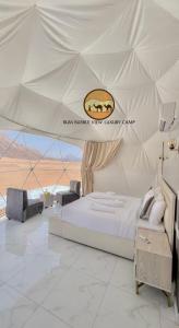 a bedroom with a large bed in a tent at RUM BUBBLES VIEW lUXURY CAMP in Wadi Rum