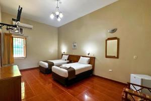 Postel nebo postele na pokoji v ubytování DM Hoteles Mossone - Ica