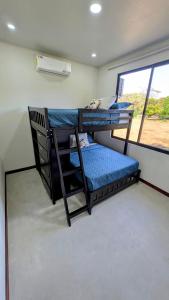 Ένα ή περισσότερα κρεβάτια σε δωμάτιο στο Los Mangos Nosara +10 φωτογραφίες