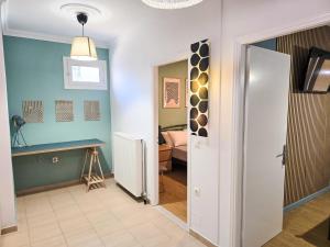 a hallway with a door leading to a bedroom at Casa Burano in Lefkada Town