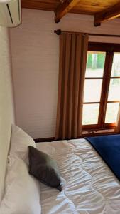 Ein Bett oder Betten in einem Zimmer der Unterkunft Casa a 2 cuadras mar Hasta 14 personas