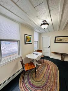 a room with a table and a large rug at Walkable near downtown 1 Bedroom in Portland