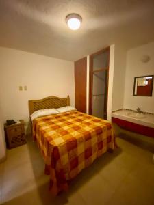 Postel nebo postele na pokoji v ubytování Hotel Centro Historico