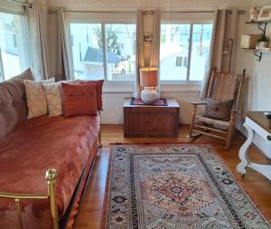 a living room with a couch and a table at Historic Oak Park Residence in Oak Park