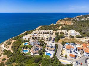 an aerial view of a villa with the ocean at Seaside apartment in Benagil with terrace in Benagil