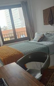 a bedroom with two beds and a chair and a window at EITHER Private 2B2B OR Shared 1B1B, Luxury, Bright, Spacious in Berlin +15 photos