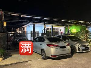 two cars are parked in a parking lot at SWEET DREAMS MUAR in Muar +3 photos