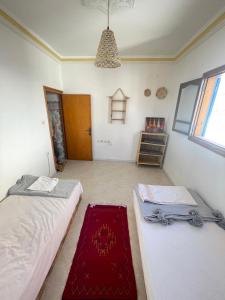 Voodi või voodid majutusasutuse Itri Surf Hostel Taghazout toas