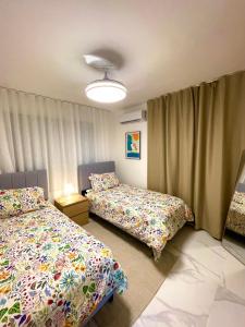 Ένα ή περισσότερα κρεβάτια σε δωμάτιο στο Villa La Casita With Prívate Pool, Cerca De Downtown Punta Cana +31 φωτογραφίες