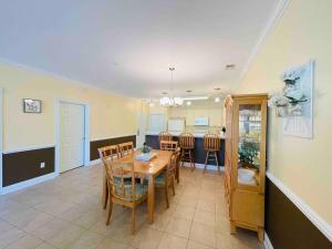 a dining room and kitchen with a table and chairs at Calming & Relaxing condo in the center of MB in Myrtle Beach