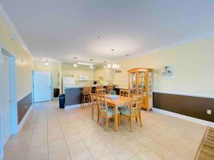 a kitchen and dining room with a table and chairs at Calming & Relaxing condo in the center of MB in Myrtle Beach