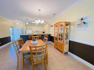 a kitchen and dining room with a table and chairs at Calming & Relaxing condo in the center of MB in Myrtle Beach
