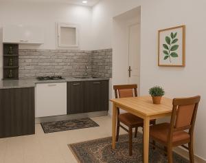 a kitchen and dining room with a table and chairs at Dar El Yasamine in Houmt Souk