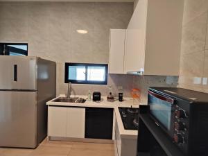 Kuchyň nebo kuchyňský kout v ubytování Endless Summer Homestay + 27 fotografií
