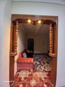a living room with a couch and a chair at شقة سكنية in Shibīn al Kawm