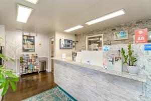 a store lobby with a stone wall at Belfair Motel in Belfair