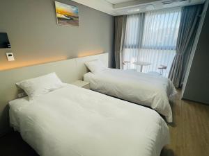 Letto o letti in una camera di INN-The City MyeongDong