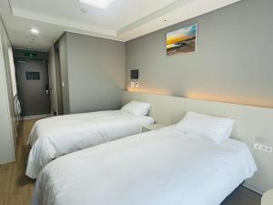 Letto o letti in una camera di INN-The City MyeongDong
