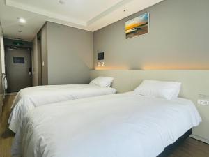 Letto o letti in una camera di INN-The City MyeongDong