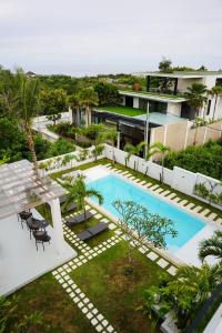 an aerial view of a house with a swimming pool at Gandum Uluwatu Luxury Boutique Stay - Gandum Villa Complex in Uluwatu