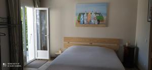 Postel nebo postele na pokoji v ubytování Gite Chambre Cuisine Parking à St Georges d'Oléron