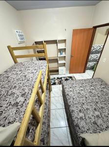 Postel nebo postele na pokoji v ubytování KL Residencial