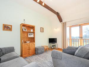 TV a/nebo společenská místnost v ubytování Barn Owl Cottage