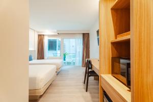 Postel nebo postele na pokoji v ubytování Baumancasa Beach Resort