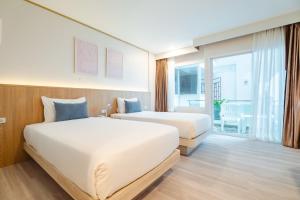 Postel nebo postele na pokoji v ubytování Baumancasa Beach Resort