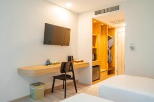 TV a/nebo společenská místnost v ubytování Baumancasa Beach Resort