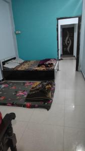Postel nebo postele na pokoji v ubytování Shree Kundkeswar Home Stay