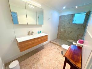 a bathroom with a sink and a shower at Galley Cove House in Geographe +30 photos