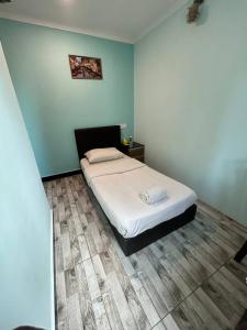 Rúm í herbergi á Sky View Hotel Dengkil Putrajaya Cyberjaya