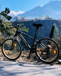 a bike parked on the side of a road at Summerwood farmhouse by rastafardreams in Katrain +32 photos