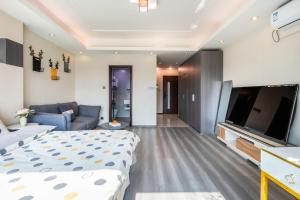 Telewizja i/lub zestaw kina domowego w obiekcie Tech-X Jing'an Hotel