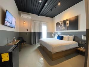 เตียงในห้องที่ Hotel NEXT