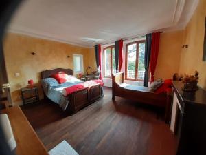 Postel nebo postele na pokoji v ubytování Grand gîte de groupe