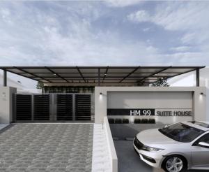 a white car parked in front of a white house at HM 99 Suite House in Johor Bahru