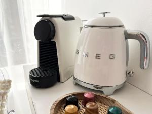 a coffee maker sitting on a counter next to a coffee pot at Premium Studio 300 m Grand-Place - hyper center Lille in Lille