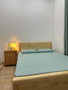 Postel nebo postele na pokoji v ubytování Nhà Happy