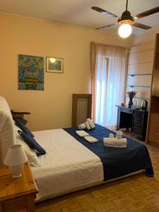Posteľ alebo postele v izbe v ubytovaní 4 Season B&B Roma