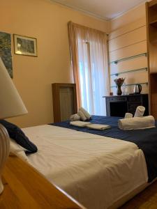 Posteľ alebo postele v izbe v ubytovaní 4 Season B&B Roma
