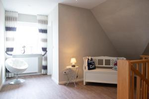 a childs room with a bed and a window at Passat in Norddeich