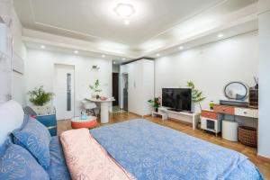 Telewizja i/lub zestaw kina domowego w obiekcie Tech-X Jing'an Hotel