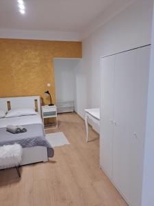 a bedroom with a bed and a white closet at Sweet home in Rab