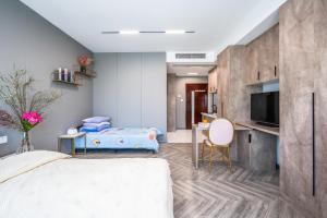 Telewizja i/lub zestaw kina domowego w obiekcie Tech-X Jing'an Hotel