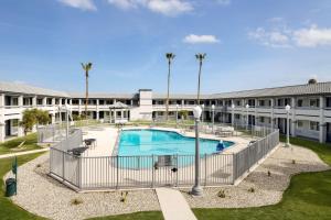 an image of a swimming pool at a building at Spark By Hilton Santa Nella in Santa Nella