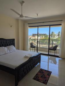 Ένα ή περισσότερα κρεβάτια σε δωμάτιο στο 3rd avenue beach apartment
