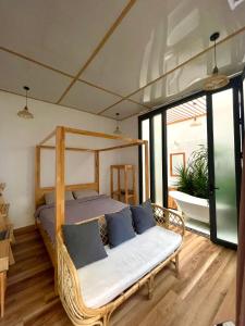 Postel nebo postele na pokoji v ubytování Dốc Garden Homestay Đà Lạt