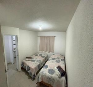 Postel nebo postele na pokoji v ubytování Casa Curicó Viñedos